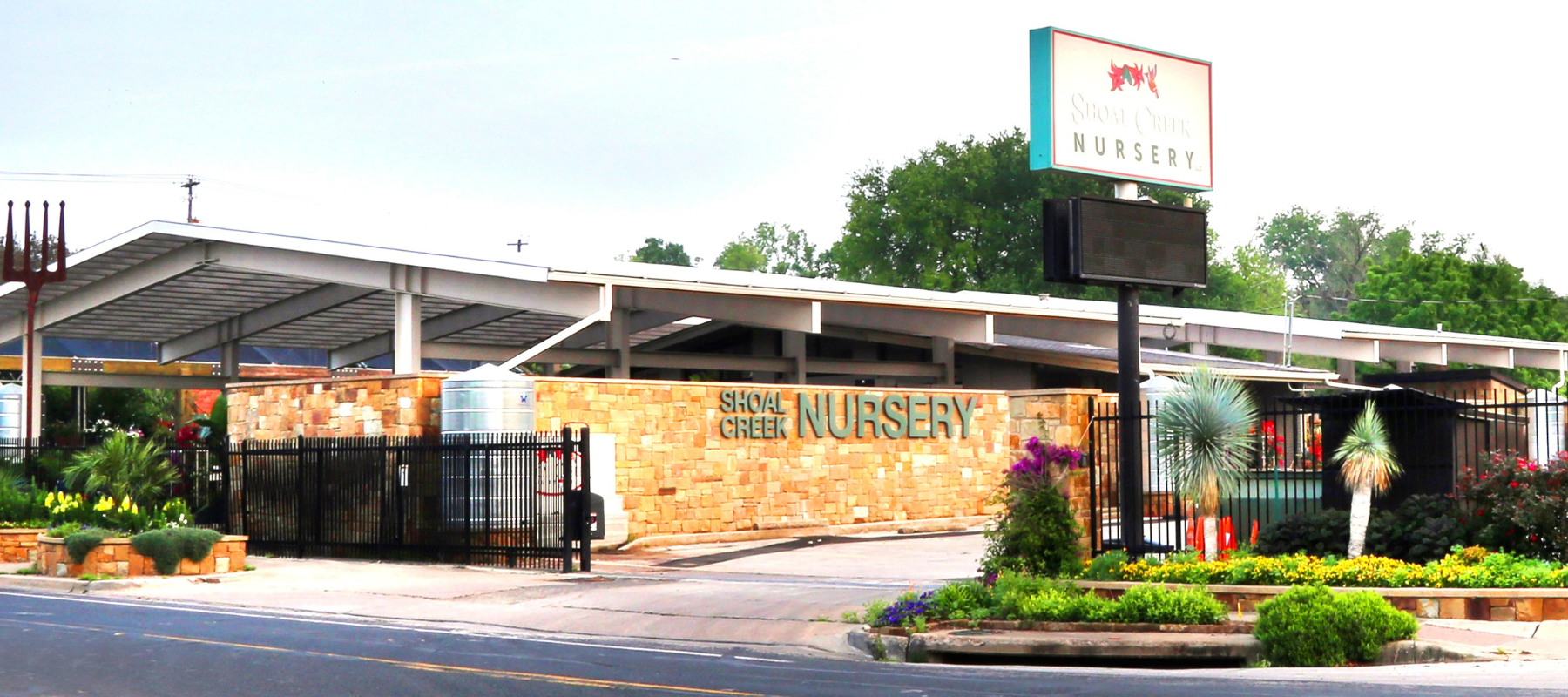 The store front of Shoal Creek Nursery on a clear day.